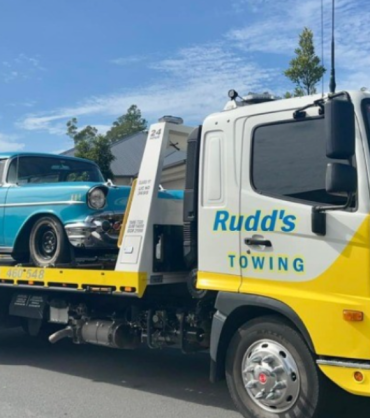 Professional tow truck safely transporting a vehicle